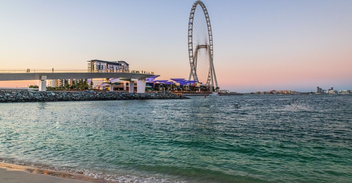 Capture the breathtaking view of Ain Dubai at sunset, overlooking the beautiful sea.